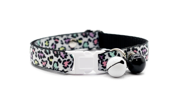 Cat collar with colorful leopard print pattern on a white background