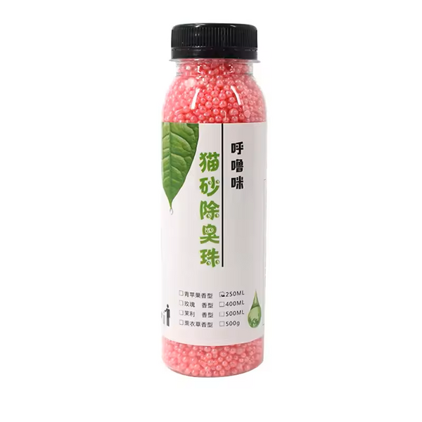 Bottle of cat litter odor eliminator with pink beads on a white background