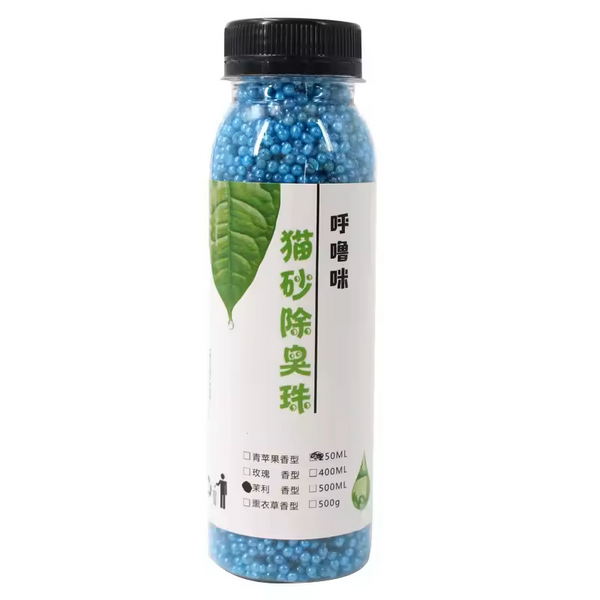 Bottle of cat litter deodorizer with a green leaf design on the label against a white background