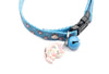 Cat collar with Paw pattern, bell, and cartoon Pendant cat charm on a white background