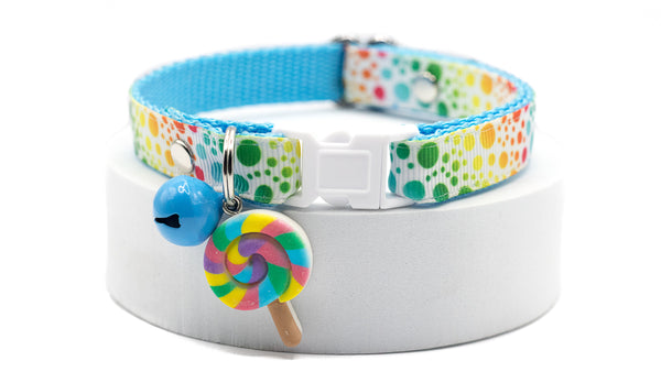 Colorful cat/dog collar with a lollipop charm on a white background