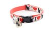 Cat collar with heart and paw pattern on a white background