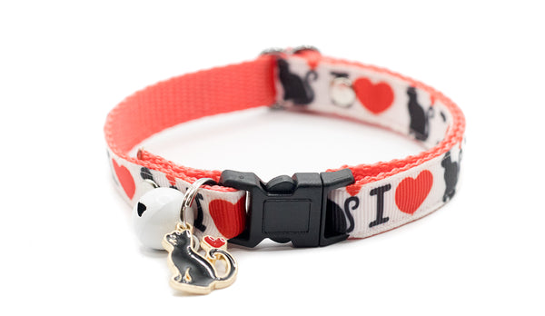Cat collar with heart and paw pattern on a white background