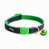 A green and black dog collar with a bright green plastic buckle, a small shiny green bell, and white bone graphics on a white background.