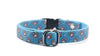 Dog collar with paw print pattern on a blue background